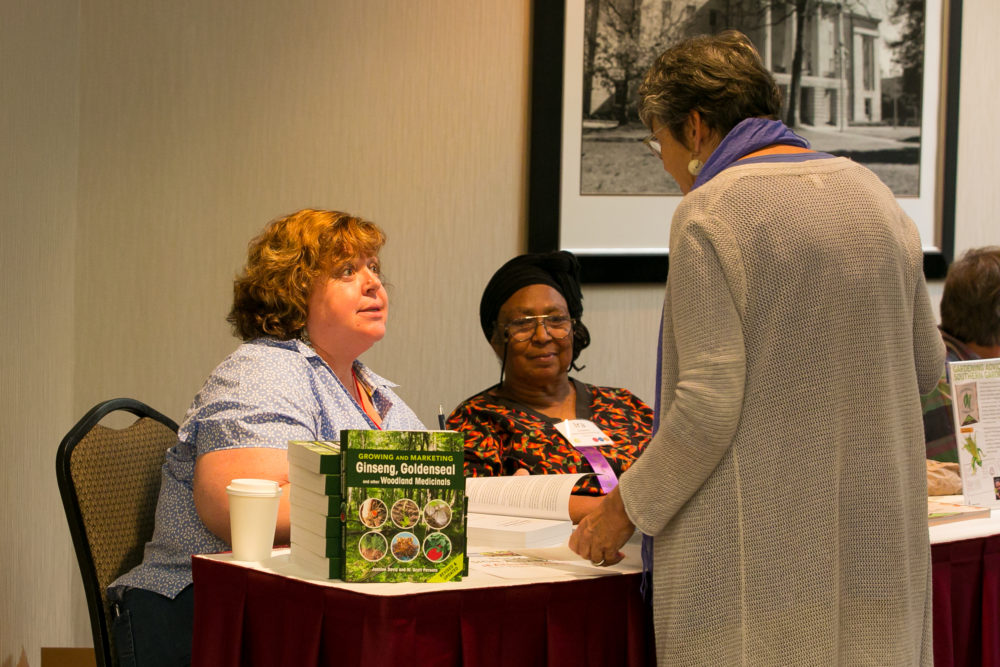 Jeanine Davis signing books at SAC