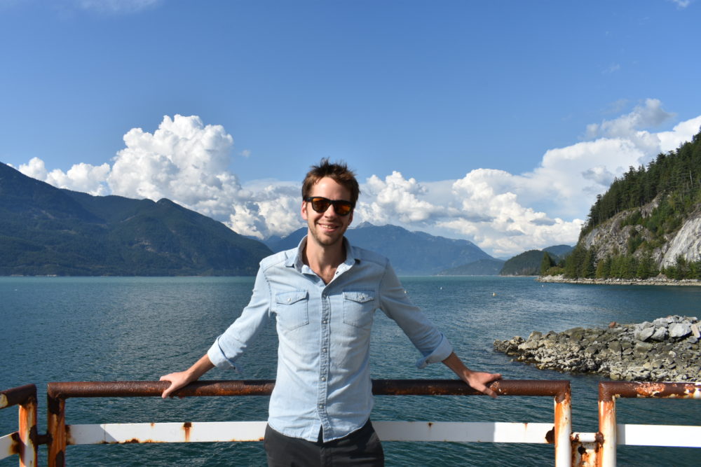 Matt Kneece standing in front of a lake