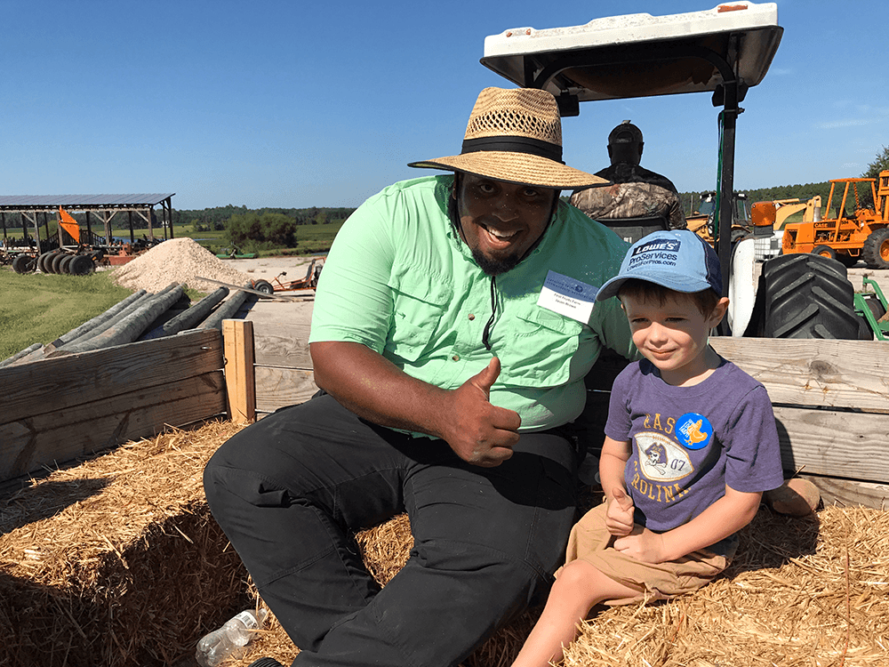 Marianna's son, Luke, taking part of CFSA's Piedmont Farm Tour at First Fruits Farm